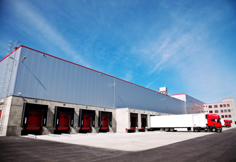 Picture of dock door at an LTL Freight Terminal with a trailer being off-loaded