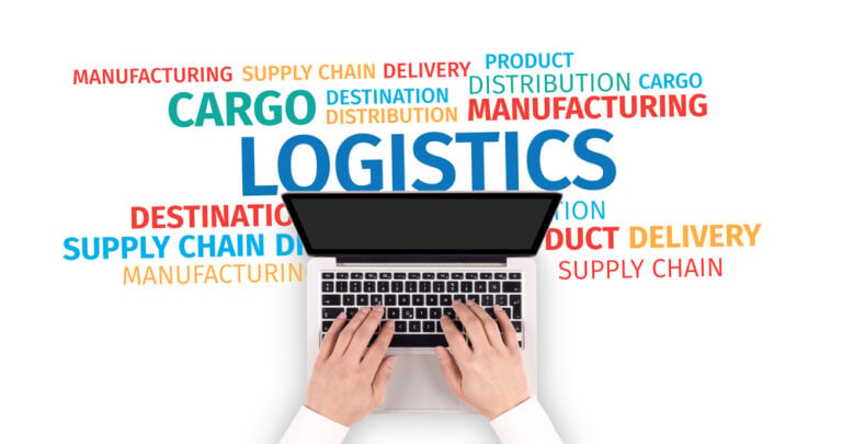 Hands typing on a laptop with logistics and supply chain keywords around it.