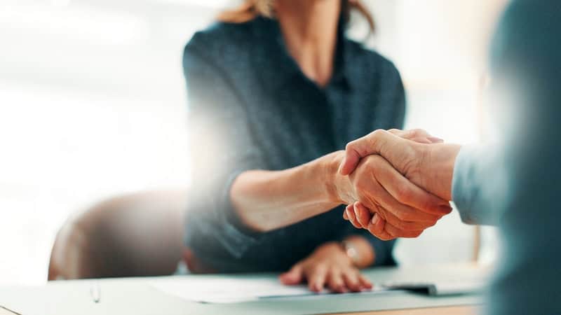Handshake with 3PL partner, freight shipping, logistics partnership