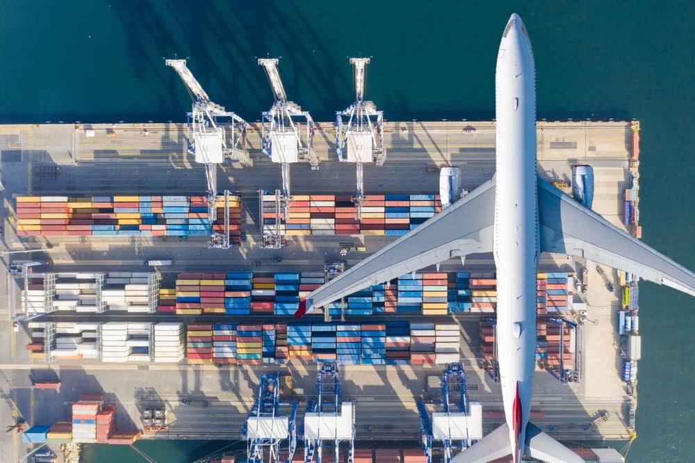 Air Transportation and transit of Container ships loading and unloading, Business logistic import-export transport sea freight with copy space.
