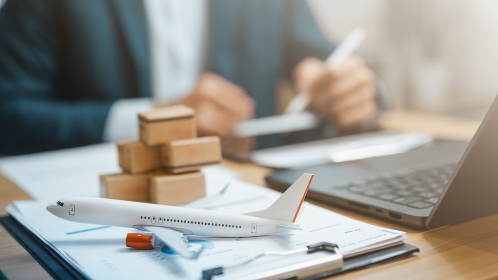 Air cargo and global logistics concept with shipping containers, transport planning, and international trade management.